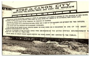 S-1749 Stop in Canyon City Sign RPPC Sanborn Postcard Canon City, Colorado