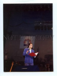 498359 Russian showman actor Dmitry Nagiyev against Kremlin vodka poster