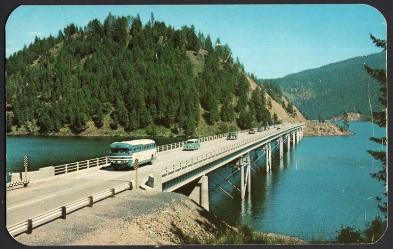 Idaho Blue Bay Bridge LAKE COEUR D' ALENE in the North with older bus1950s-1970s