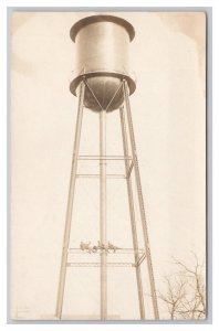 Postcard Men Sitting On Water Tower Around Solomon Kansas RPPC Real Photo