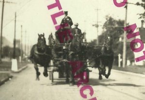 Corvallis OREGON RPPC c1910 FIRE DEPARTMENT Firewagon FIREMEN RACING DOWN STREET