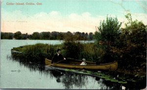 Postcard Ontario Orillia Cedar Island Man & Boy in Canoe Lotus Plants 1907 K83