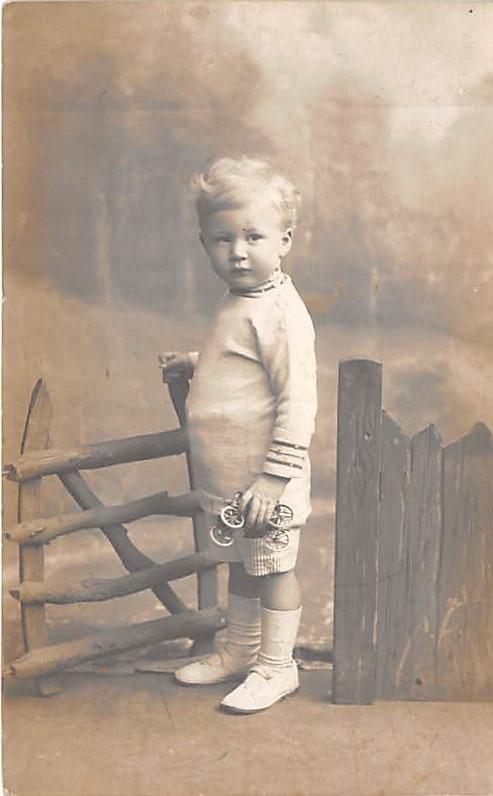 Young child with toy car Child, People Photo Writing on back 