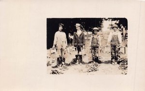 CHILDREN WITH WOOD BASKETS OF VEGETABLES? ~1914 REAL PHOTO POSTCARD