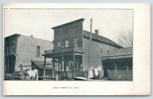 Ely IA~Balcony on Drug Store~Western Facade ~Baby on Fence~Hitching Posts c1910