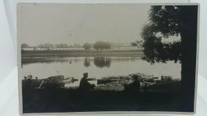 Antique WW1 Postcard Latvian/Russian Soldiers watch Men Load Barges With Wood