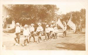 Anamosa Iowa~Parade~Kids Holding Rope~People Carrying Flags~c1910 RPPC Postcard