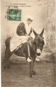 Lady riding a donkeyv Nice old vintage French postcard