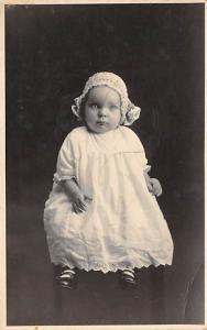 Young baby dressed up Garaita Graham 11 months old Writing on back 