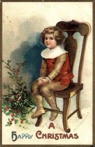 Christmas - Boy Sitting in Chair c1910 Clapsaddle Postcard
