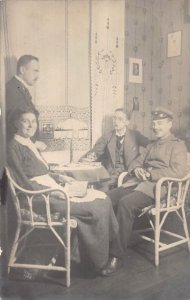 A094 Real Photo 1915 Evening Company Soldier smoking laughing WWI field postcard