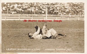 Canada, Manitoba, Winnipeg, RPPC, Rodeo, Cowboy L.E. McCoy Bulldogging a Steer