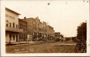 Hawkeye Iowa~Main Street~Hotel~Barber Shop~Ladies in Store Door~Wagon~1916 RPPC 