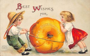 Thanksgiving Greetings Children Moving Giant Pumpkin embossed postcard B990