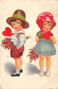 Lot269 boy giving to a girl a heart and flower children germany