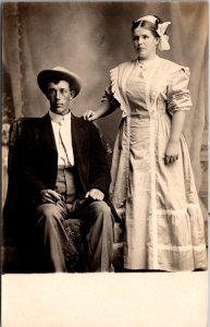Real Photo Postcard Portrait of Man and Woman in Photo Studio