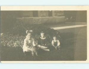 Pre-1918 rppc GIRL WITH BOW IN HAIR ON CURB Bowling Green Ohio OH v5192