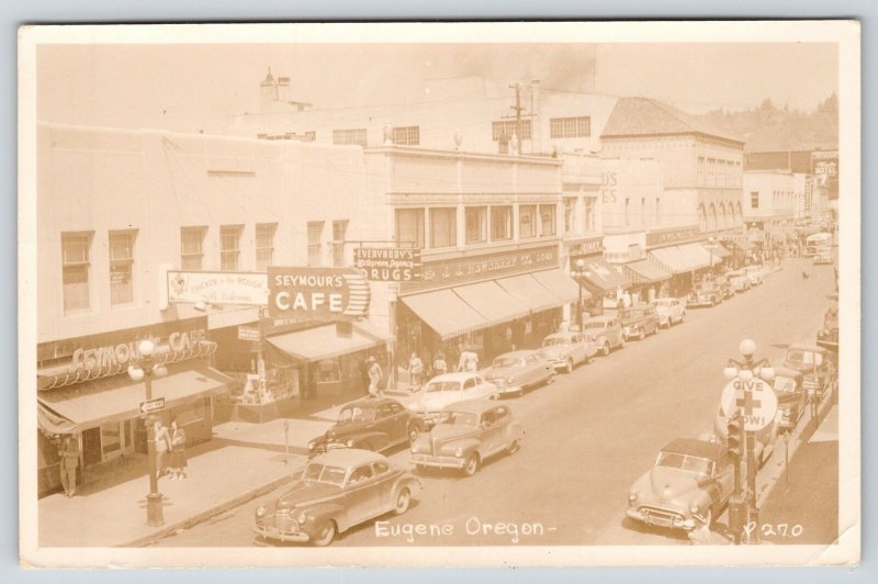 Eugene Oregon~Downtown: Seymour's Cafe~JJ Newberry~Give Red Cross Now~1940s RPPC 