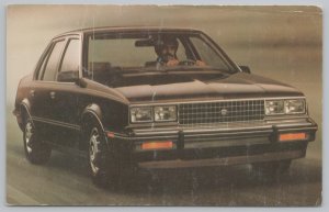 Transportation~Man Driving Black Cadillac From 1982~Vintage Postcard