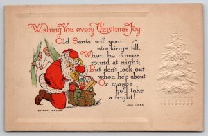 Christmas Joy Santa Toy Sack Children Peeking 1912 Postcard X27