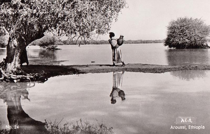 Real Photo Postcard Africa Ethiopia native water carrier at Sombay Lake Aroussi