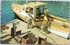 Men unloading lobsters from boat for weighing. Maine postcard