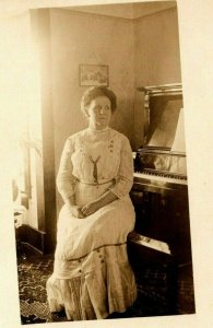 Vintage 1910's RPPC Postcard - Woman in White Dress Sitting at the Piano