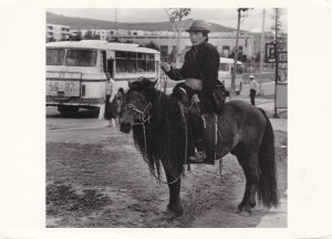 Young Mongol Astride A Stallion In The City Photograph By Builder Levy 1992