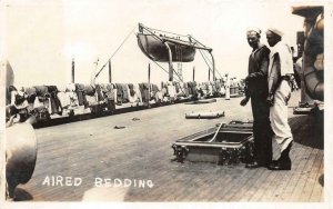 RPPC AIRED BEDDING SHIP MILITARY REAL PHOTO POSTCARD (1920s)