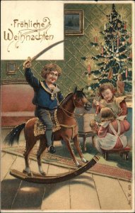 German Christmas Little Boy Sword on Rock Chair c1910 Embossed Postcard