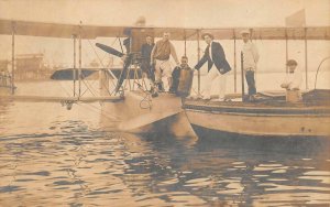 RPPC LINDBERGH HOLDING MAIL BAG HYDROPLANE AVIATION REAL PHOTO POSTCARD (1920s)