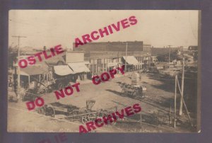 St. Johns KANSAS RPPC 1906 HALLOWEEN PRANKS Wagons MANURE SPREADER Main Street