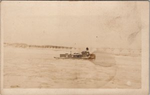 Tugboat in Ocean Man Standing Top Boat Cabin Long Bridge Real Photo Postcard Z14