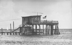 J35/ Cedar Key Florida RPPC Postcard c1950s Pier Flag Dock Sailboat  47