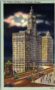 VINTAGE POSTCARD THE WRIGLEY BUILDING AND STREET SCENE UNDER MOONLIGHT CHAS LEVY