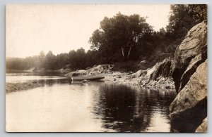 RPPC Maine Beautiful Rocky Shoreline with Rowboat Helen S Baldwin Postcard M38
