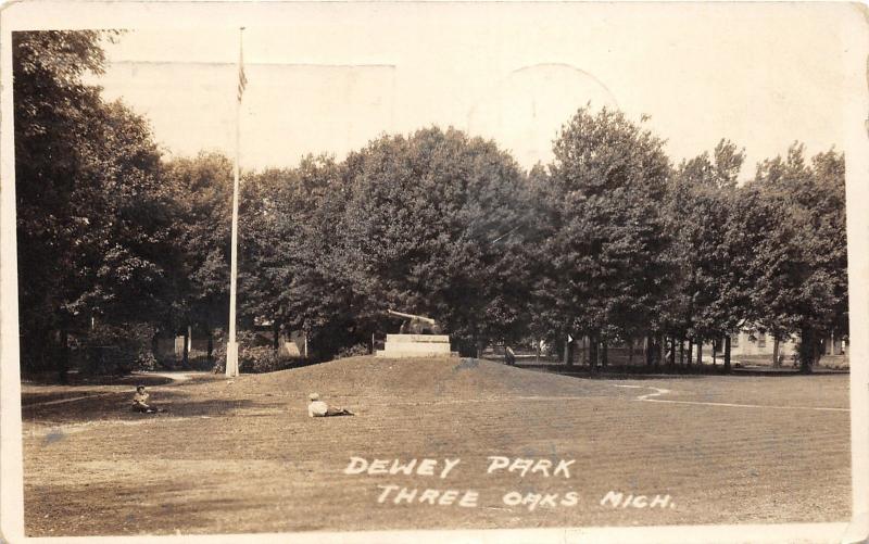 Three Oaks Michigan~Dewey Park~Boys Laying on Grass~Cannon/Flag Display~'23 RPPC