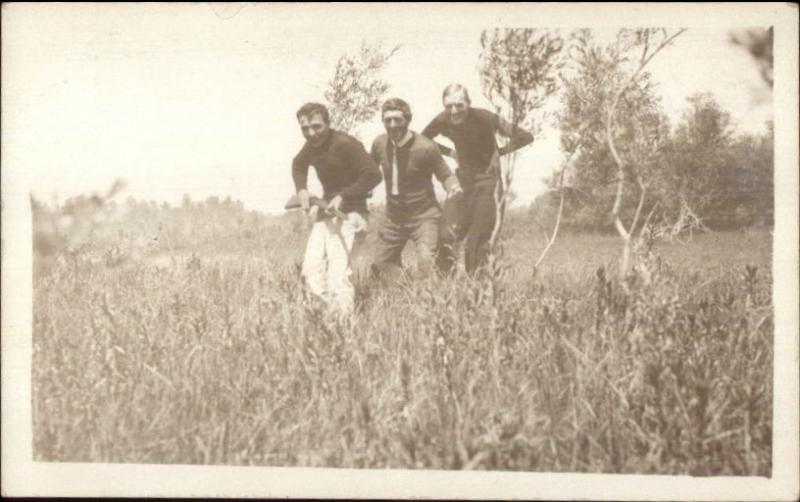 Men Being Silly Stalking in Grass w/ Gun c1910 Real Photo Postcard