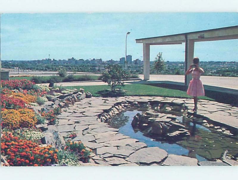 Pre-1980 WOMAN IN PINK DRESS TAKES TOURIST PICTURE AT POOL Calgary AB F8596