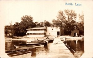 Real Photo Postcard Boats, Dock, Building, Beach in Battle Lake, Minnesota