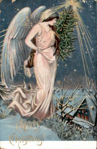 Christmas Angel with Tree Overlooks Village Gilt Embossed Vintage Postcard
