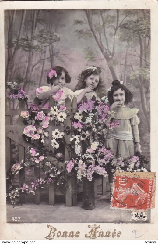 RP; NEW YEAR, PU-1910; Bonne Annee, Three little girls behind fence covered w...