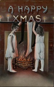 Christmas Girls Hang Stockings on Fireplace Mantel Gel SB c1900s-20s Postcard