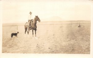 H57/ Fargo North Dakota RPPC Postcard c1914 Cowboy Horse Lasso Dog 83