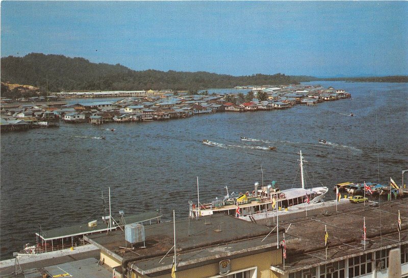 us8169 state of brunei harbour in foreground and floating houses in centre