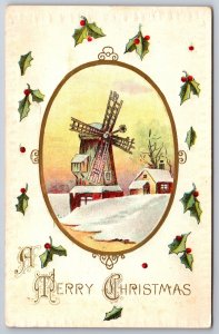 A Merry Christmas~Winter Windmill In Oval Frame W/ Holly~Emb~Vintage Postcard