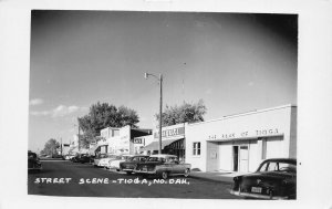 J81/ Tioga North Dakota RPPC Postcard c1940s Street Scene Bank Stores 477