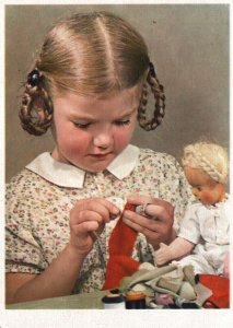 CONTINENTAL SIZE POSTCARD GIRL WITH DOLL ON SOFT PAPER DATED 1949 (E. EUROPE)