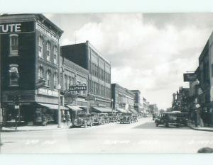 Pre-1950 rppc SHOPS ALONG STREET Alpena Michigan MI W0205