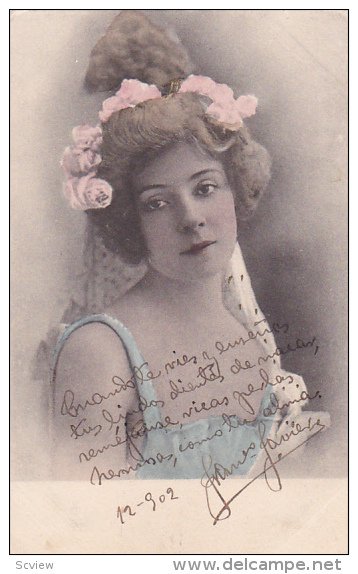 Portrait of woman with pink flowers in her hair, 00-10s